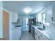 Modern kitchen features white cabinets, stainless steel appliances, and sleek countertops at 2282 Tiffany Ct, Jonesboro, GA 30236
