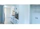 Kitchen showcasing stainless steel oven and range with white cabinets and open shelving at 2282 Tiffany Ct, Jonesboro, GA 30236
