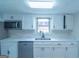 Modern kitchen with white cabinets, updated countertops, and stainless steel appliances at 2282 Tiffany Ct, Jonesboro, GA 30236
