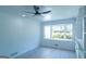 Well-lit living room with a bay window, ceiling fan, and new flooring at 2282 Tiffany Ct, Jonesboro, GA 30236