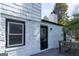 Rear view of the home, painted brick, with a door leading out to the deck at 2282 Tiffany Ct, Jonesboro, GA 30236