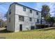 A view of the back of the home, painted brick, with a deck area at 2282 Tiffany Ct, Jonesboro, GA 30236