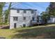 A view of the back of the home, painted brick, with a deck area at 2282 Tiffany Ct, Jonesboro, GA 30236