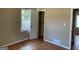 Cozy bedroom with hardwood floors, a closet, and a window for natural light at 1271 Sanders Dr, Lake City, GA 30260