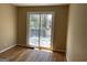 Hardwood flooring and sliding glass doors to deck, this bedroom is a relaxing retreat at 1271 Sanders Dr, Lake City, GA 30260