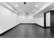 Unfinished basement with dark floors and ceiling fan at 1301 Blue Sky Ct, Peachtree City, GA 30269