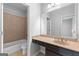 Bathroom features an extended vanity and tiled shower and tub at 1301 Blue Sky Ct, Peachtree City, GA 30269