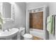 Cozy bathroom with a tiled shower, vanity, and decorative mirror, providing a comfortable and stylish space at 1301 Blue Sky Ct, Peachtree City, GA 30269
