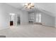 Neutral bedroom featuring built-in shelves and ceiling fan at 1301 Blue Sky Ct, Peachtree City, GA 30269