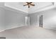 Bedroom features tray ceilings, neutral walls and carpet at 1301 Blue Sky Ct, Peachtree City, GA 30269