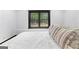Comfortable bedroom with large window and black trim at 1301 Blue Sky Ct, Peachtree City, GA 30269