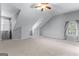 Spacious bedroom with vaulted ceilings, plush carpeting, and natural light at 1301 Blue Sky Ct, Peachtree City, GA 30269