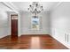 Beautiful dining room with hardwood floors, chandelier, and front door at 1301 Blue Sky Ct, Peachtree City, GA 30269