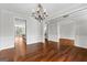 Open dining room with hardwood floors and stylish lighting at 1301 Blue Sky Ct, Peachtree City, GA 30269