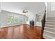 Bright living room with fireplace, built-ins, and hardwood floors at 1301 Blue Sky Ct, Peachtree City, GA 30269