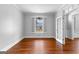 Bright room featuring hardwood floors, white trim, and natural light at 1301 Blue Sky Ct, Peachtree City, GA 30269