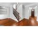 Elegant staircase with hardwood floors and decorative railings at 1301 Blue Sky Ct, Peachtree City, GA 30269