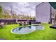 Spacious backyard with a kidney-shaped pool, turf, and outdoor lounge area perfect for relaxation and entertainment at 4450 Sterling Forest Dr, Decatur, GA 30034