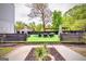 Turf backyard featuring an in-ground pool, lounge chairs, heaters, and planters for outdoor entertaining at 4450 Sterling Forest Dr, Decatur, GA 30034