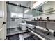 Modern bathroom featuring marble tile, glass shower enclosure, soaking tub, and double sink vanity at 4450 Sterling Forest Dr, Decatur, GA 30034