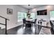 Chic dining area with a marble-top table, sleek black chairs, and modern lighting fixture at 4450 Sterling Forest Dr, Decatur, GA 30034