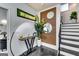 Elegant foyer featuring a modern console table, stylish mirrors, and sleek black-and-white staircase at 4450 Sterling Forest Dr, Decatur, GA 30034
