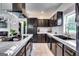 Contemporary kitchen with dark cabinetry, marble countertops, and high-end stainless steel appliances at 4450 Sterling Forest Dr, Decatur, GA 30034