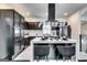 Modern kitchen featuring sleek black cabinets, marble accents, and stylish island seating at 4450 Sterling Forest Dr, Decatur, GA 30034
