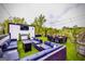 Rooftop lounge area featuring multiple seating areas, outdoor lighting, and a TV for entertaining guests at 4450 Sterling Forest Dr, Decatur, GA 30034