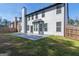 Wide backyard with a stone patio perfect for outdoor seating and entertaining at 8030 Snapwell Dr, Fairburn, GA 30213