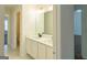 Well-lit bathroom featuring a double sink vanity with marble countertops and modern fixtures at 8030 Snapwell Dr, Fairburn, GA 30213