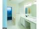 Bathroom featuring a double sink vanity with marble countertop and a large mirror at 8030 Snapwell Dr, Fairburn, GA 30213