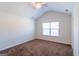 Neutral bedroom with a ceiling fan, vaulted ceilings, and a large window at 8030 Snapwell Dr, Fairburn, GA 30213