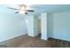 A bright bedroom features neutral walls, carpeted floors, and a ceiling fan at 8030 Snapwell Dr, Fairburn, GA 30213