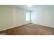 Spacious bedroom features neutral tones and carpeted flooring, providing a versatile space at 8030 Snapwell Dr, Fairburn, GA 30213
