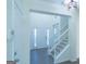 Bright foyer with staircase, chandelier, and view to living area with soaring ceilings and plenty of light at 8030 Snapwell Dr, Fairburn, GA 30213