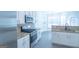Modern kitchen featuring white cabinets, stainless steel appliances, and granite countertops at 8030 Snapwell Dr, Fairburn, GA 30213