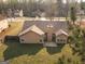 Aerial view of home showing roof, chimney, backyard, patio, and other homes at 1109 Norsworthy Ml, Hampton, GA 30228