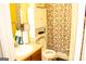 Cozy bathroom with brown cabinets, and a shower curtain at 1109 Norsworthy Ml, Hampton, GA 30228