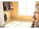 Walk-in closet with carpet, shelving, and a window, offering plenty of storage space at 1109 Norsworthy Ml, Hampton, GA 30228