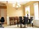 Bright dining area featuring a stylish chandelier, neutral walls, and natural lighting at 1109 Norsworthy Ml, Hampton, GA 30228
