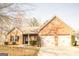 Charming single-story brick home featuring an attached two-car garage at 1109 Norsworthy Ml, Hampton, GA 30228