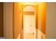Hallway with arched doorway and white doors with a clean and neutral color palette at 1109 Norsworthy Ml, Hampton, GA 30228