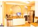 Bright kitchen featuring a stainless steel dishwasher, white cabinetry, and wood-style flooring at 1109 Norsworthy Ml, Hampton, GA 30228