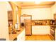 Well-lit kitchen featuring stainless steel appliances, granite countertops, and wooden floors at 1109 Norsworthy Ml, Hampton, GA 30228