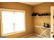 Bright laundry room with neutral paint, shelving, and ironing board at 1109 Norsworthy Ml, Hampton, GA 30228