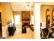 Spacious living room with a cozy brick fireplace, neutral walls, and carpeted floors at 1109 Norsworthy Ml, Hampton, GA 30228
