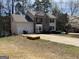 Two-story house with a two car garage and long driveway at 645 Legend Sw Ct, Atlanta, GA 30331