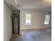 Garage featuring concrete floor, water heater, and natural light, a functional and practical space at 125 Mcintosh Estates Dr, Sharpsburg, GA 30277