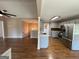 Kitchen features stainless steel appliances and is located next to the dining and living room at 125 Mcintosh Estates Dr, Sharpsburg, GA 30277